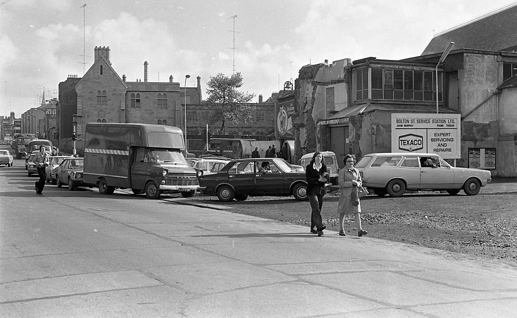 Street scene, people queuing for petrol, 1975