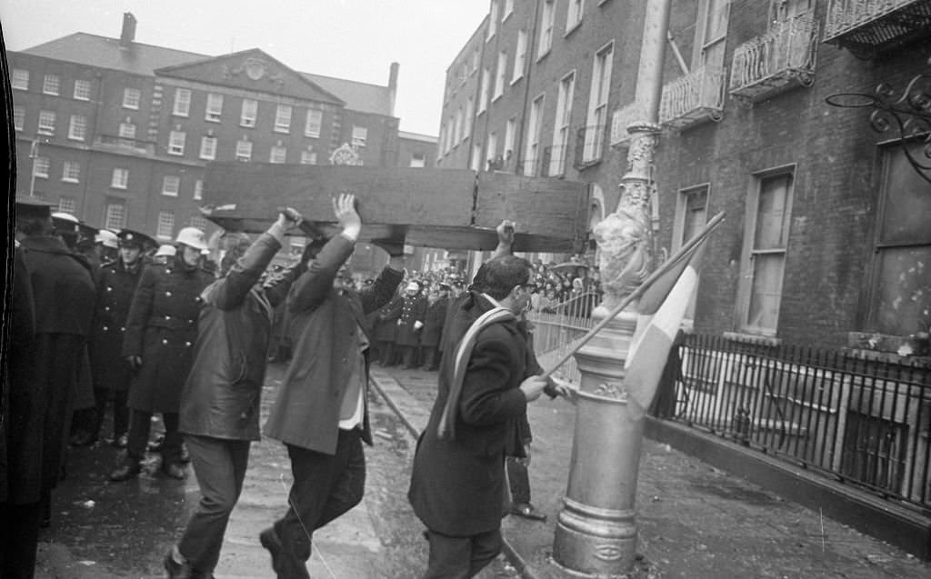 Protestors brining a mock coffin March to the burnt-out British Embassy on Merrion Sq that had been destroyed in the proterst the previous night, 1972