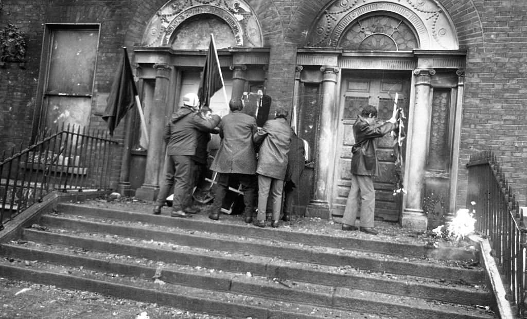 Protestors brining a mock coffin March to the burnt-out British Embassy on Merrion Sq that had been destroyed in the proterst the previous night, 1972.