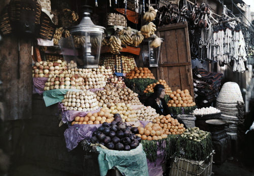 Woman sitting with her fruits for sale.