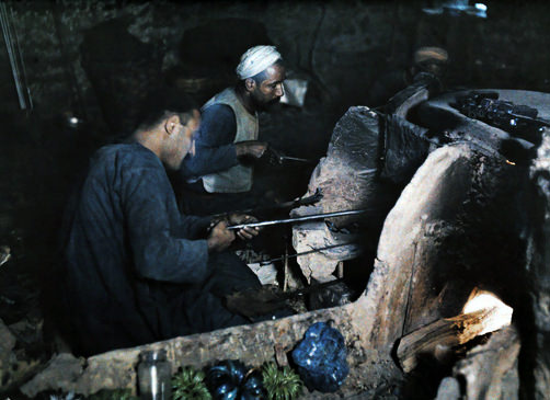 Two men making glass.