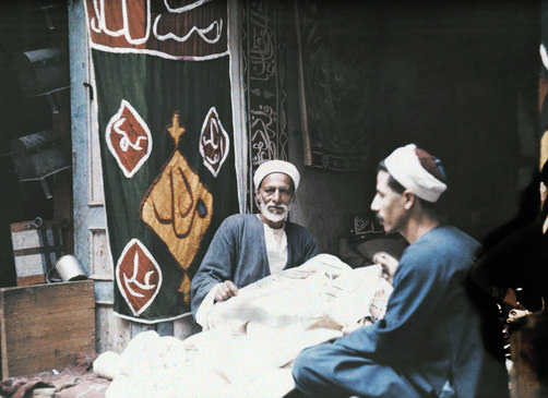 Two men making tents.