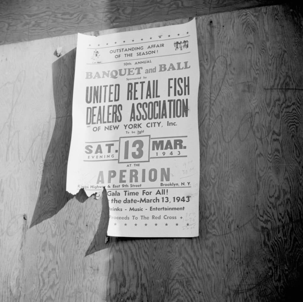 A sign at the Fulton fish market advertising a fish dealers' banquet and hall, 1942