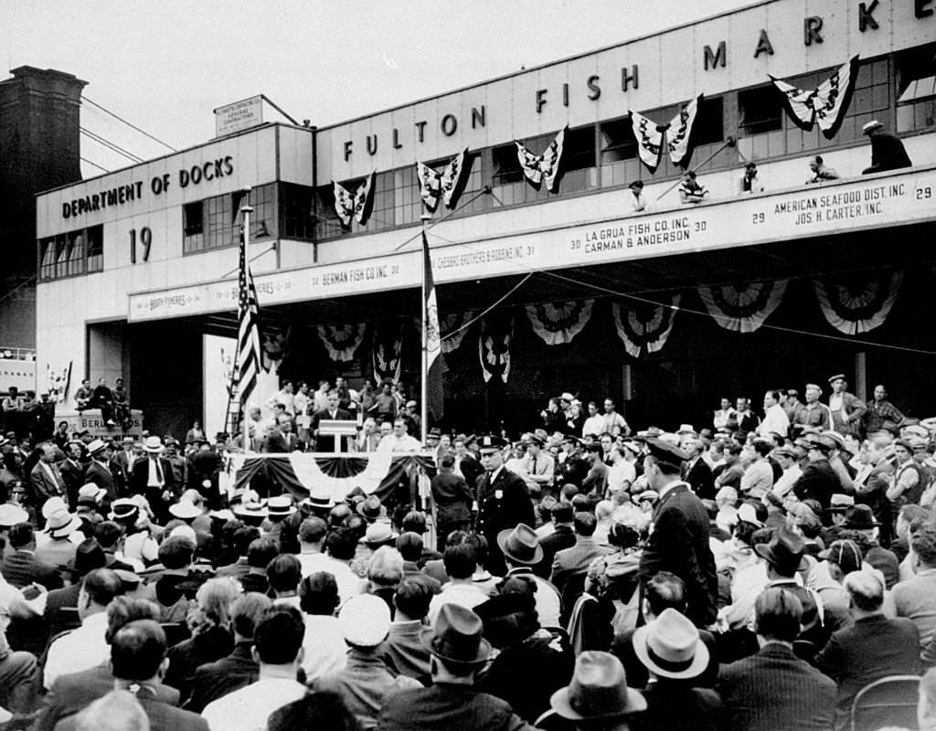 Mayor Fiorello LaGuardia speaking at opening of Fulton Fish Market, at Bleecker Street and South Street, 1940s