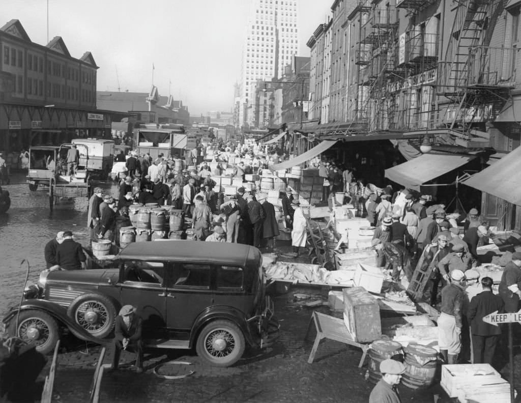 Overview of the Fulton Fish Market on South Street, from where the fish are taken to the nearby wholesalers, New York, 1938.