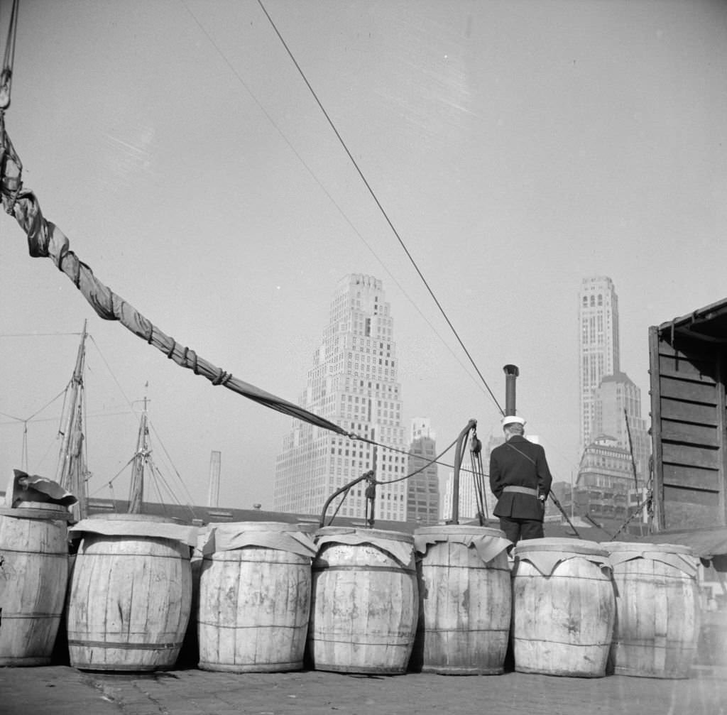 Barrels of fish on the docks at Fulton fish market ready to be shipped to retailers and wholesalers, 1920s