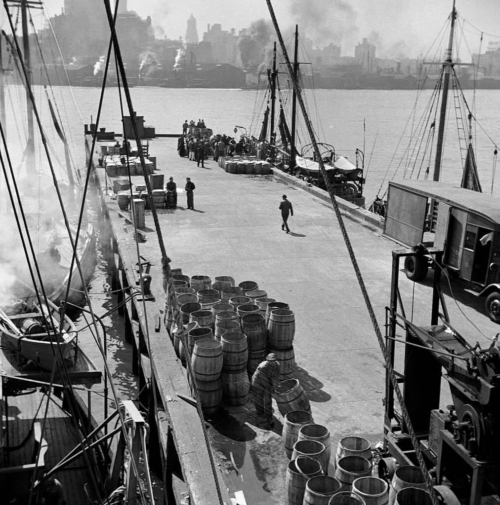 The dock at the Fulton Fish Market where New England fishing boats unload their cargo, May 1943.