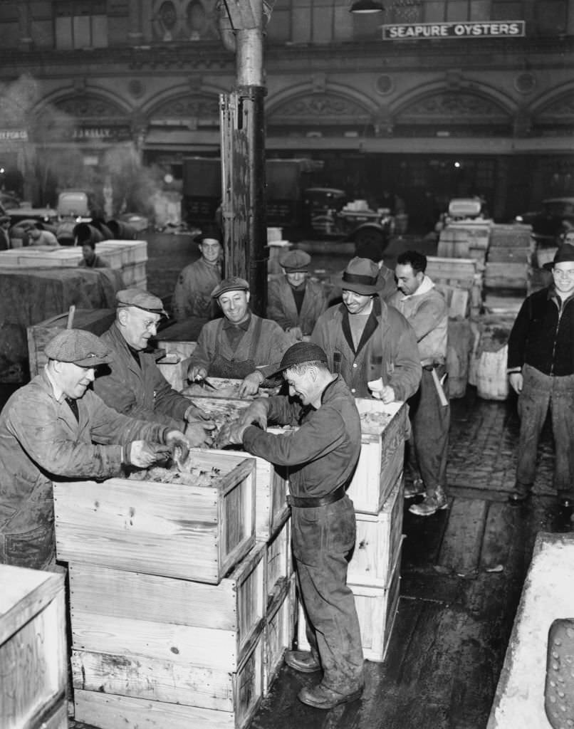 Fishmongers sorting out shrimps in crates at New York's famous Fulton Fish Market, 23rd December 1941.