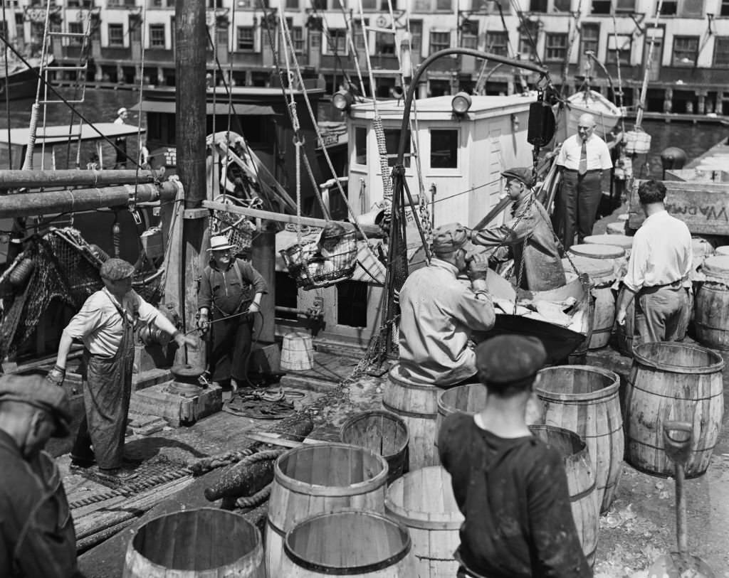 Unloading fish at Fulton Fish Market in the Bronx, New York City, 6th June 1940.