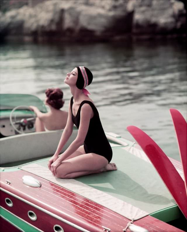 Barbara Mullen and Marie-Helene (at the helm), Cap D'Antibes, Eden Roc, 1957