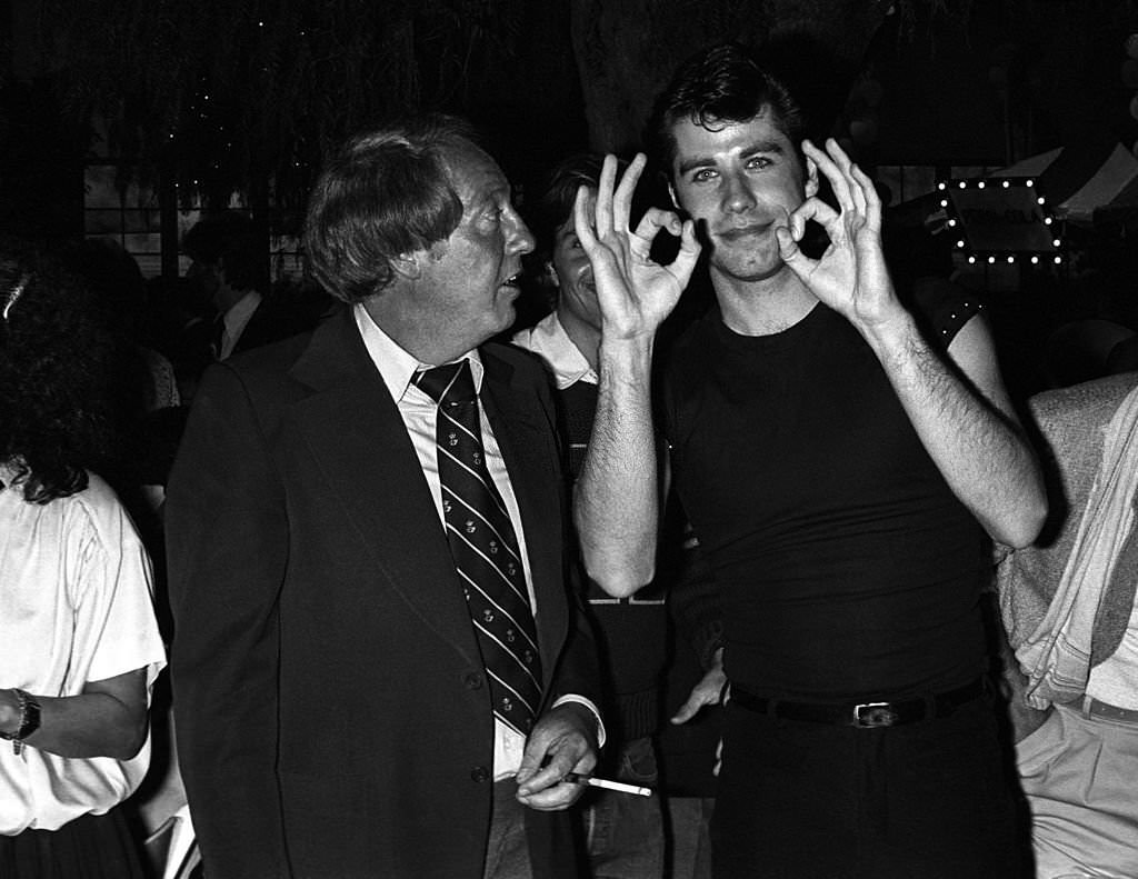Producer Robert Stigwood and John Travolta at the "Grease" party at Paramount Studios 1978 in Los Angeles, California.
