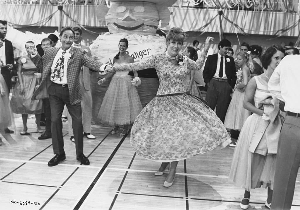 Eve Arden as Principal McGee and Sid Caesar as Coach Calhoun in a scene from the Paramount musical 'Grease', 1978.