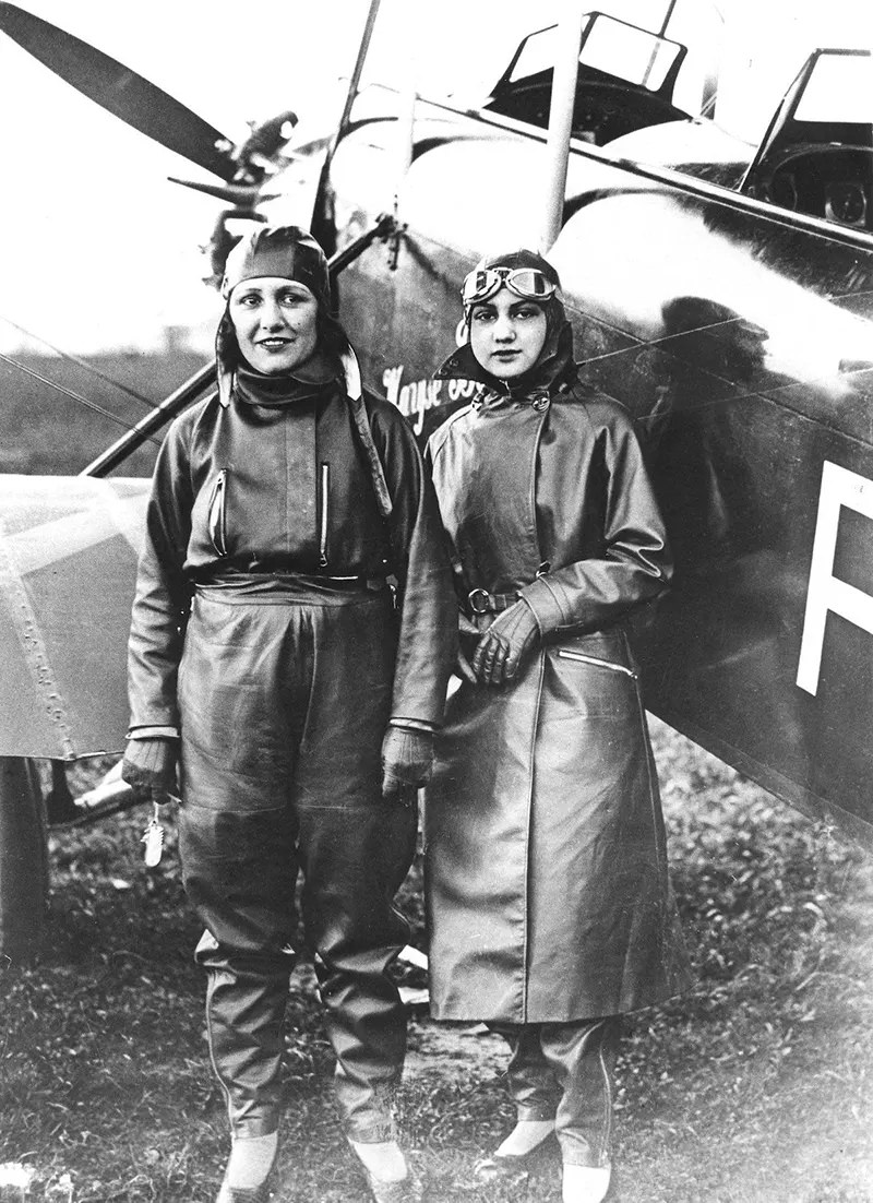 Maryse Bastiè (1898-1952) and Gilda de Bankford. Bastié’s fascination with flight began when she married a WWI pilot. Her husband died in a plane crash in 1926.