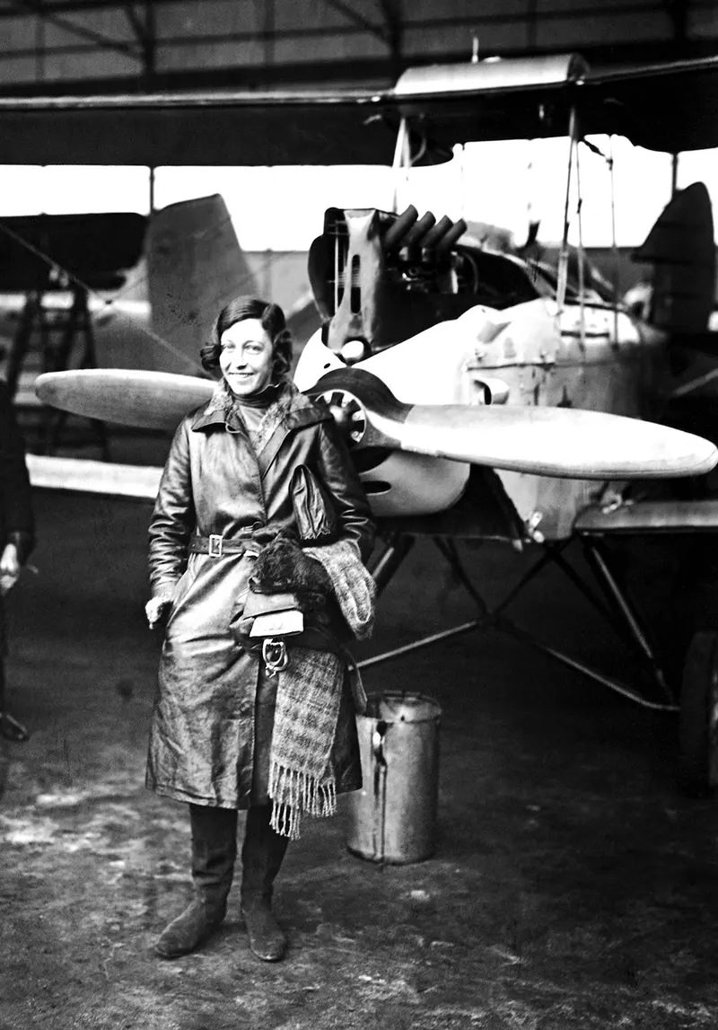 English aviatrix Amy Johnson (1903-1941) shown at a landing in Berlin. She was the first woman to make a solo flight from London to Australia in 1930.