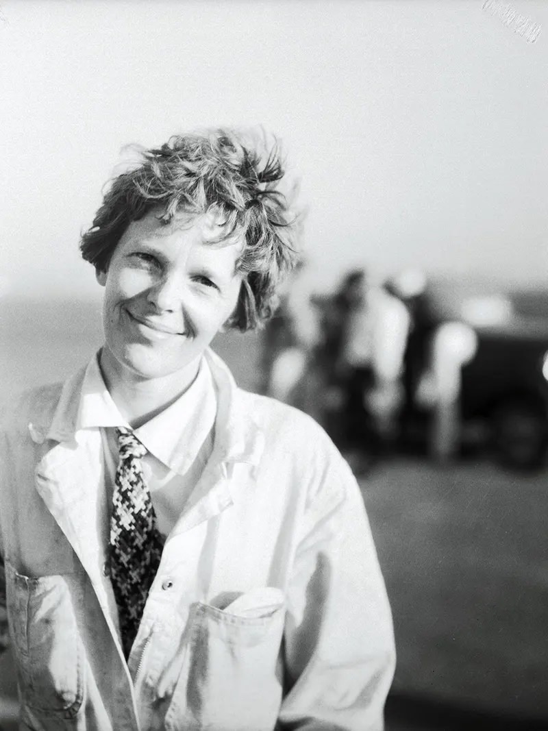 “Amelia Earhart, first lady of aviation, is shown immediately after she landed her Lockheed Vega plane at the Los Angeles Municipal Airport, July 2, after completing a transcontinental flight from the East.