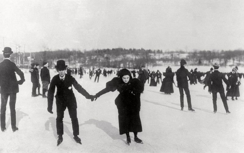 Women and men ice skate on a lake in New York's Central Park, 1893.