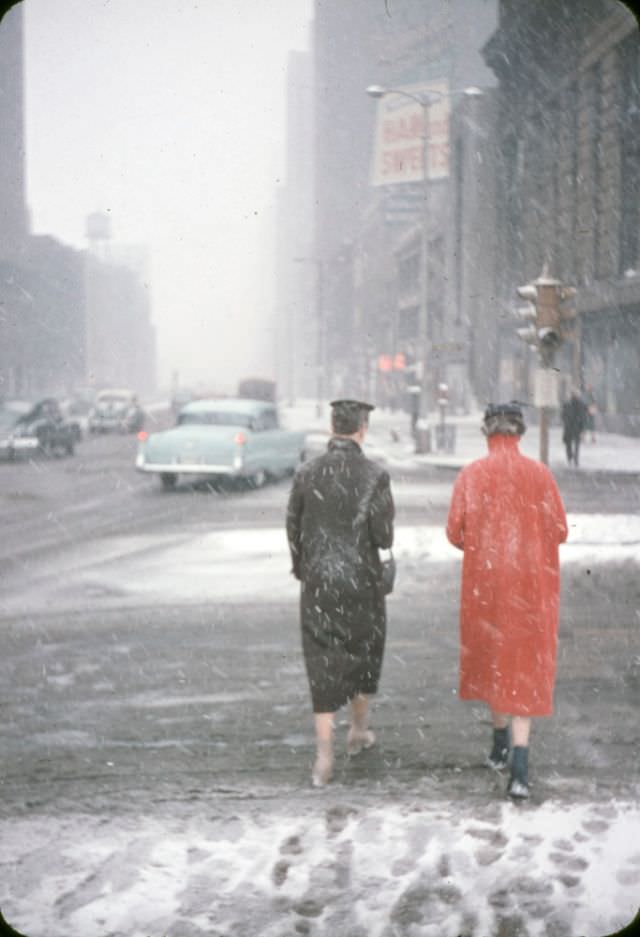 Two women on street during a snowstorm, Chicago, 1956.
