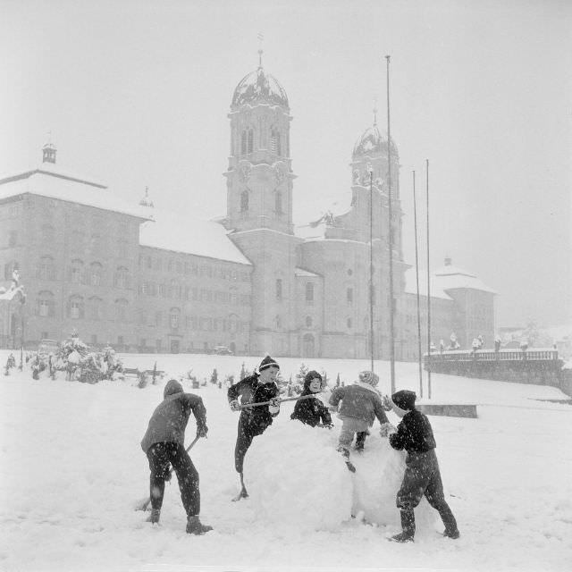 Children playing in the snow in Einsiedeln, Switzerland, 1959.