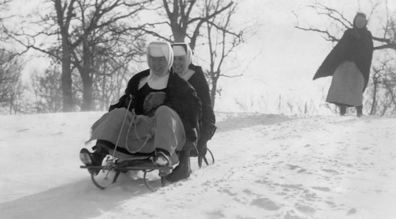 Nuns of the St. Mary of the Angels convent sled on the slopes of Long View Park in Rock Island, Illinois, February 1965.