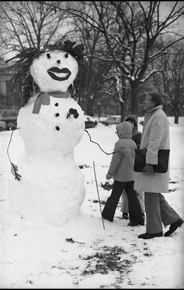 President Jimmy Carter admires a snowman on the lawn of the White House in Washington, January 1978.