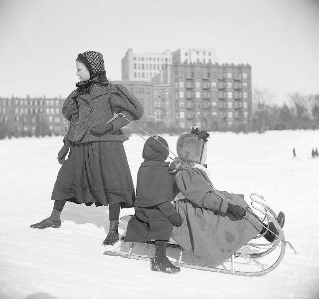 Children sledding, 1897.