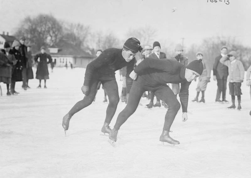 Two men race ice skating, 1900.