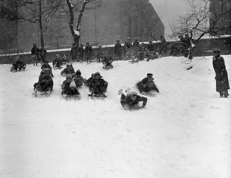 Children sledding, 1935.