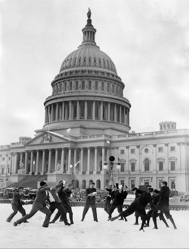 Young men have a snowball fight in front of the Capitol, Washington DC, January 1939.