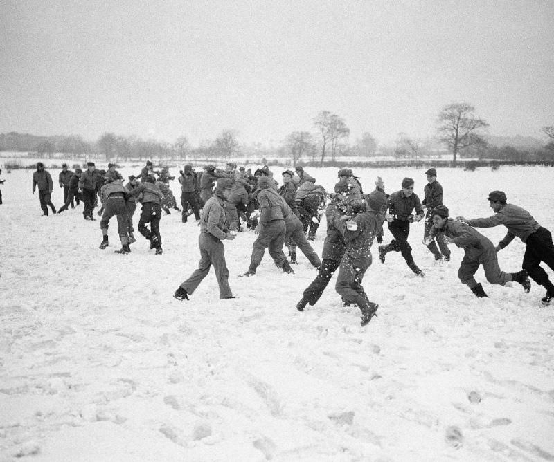 Army troops enjoy a snowball fight at a base in Northern Ireland, April 1942.