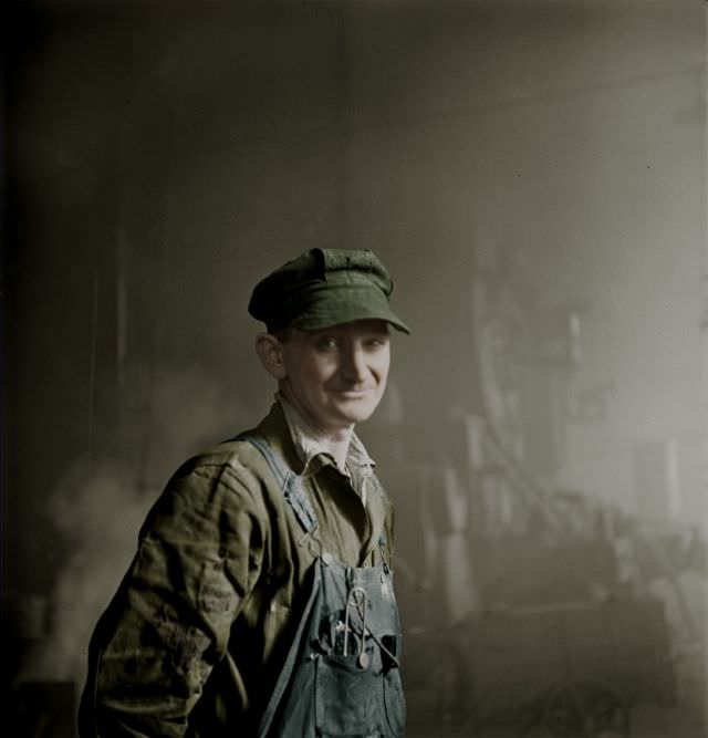 Welder who was employed in the roundhouse at a Chicago and Northwestern Railroad yard, Chicago, Illinois, December 1942