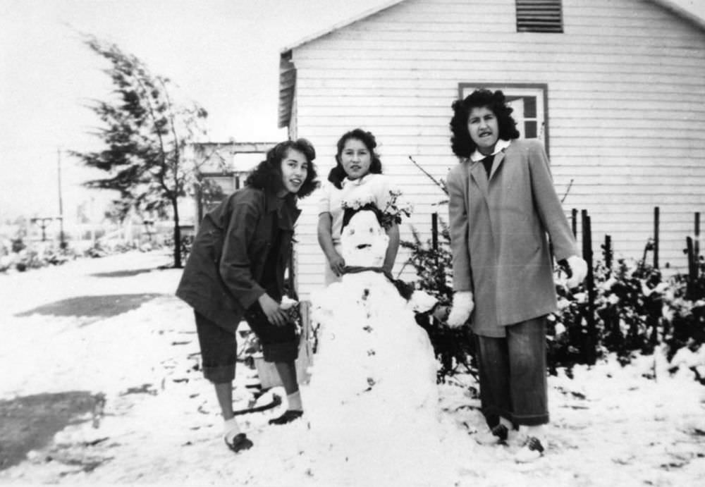 Ladies building a snowman in North Hollywood.