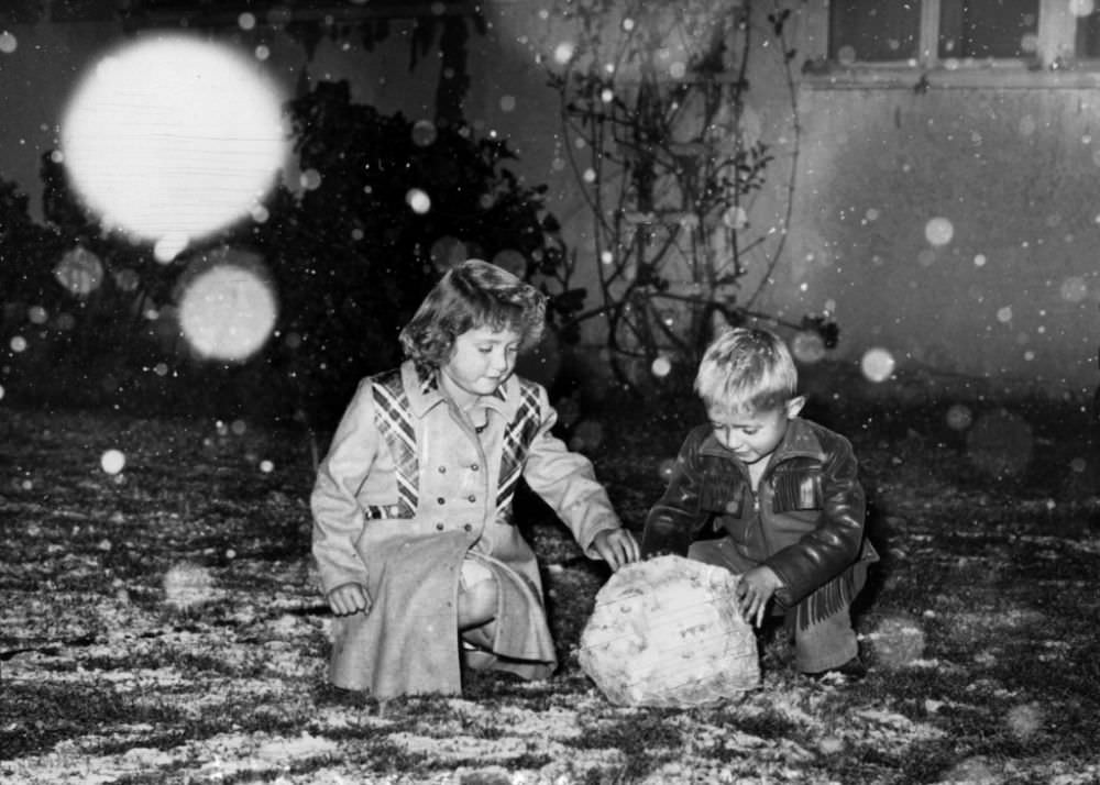 Patricia and James Perkins of Riverside, like most members of a new generation, see snow for the first time.