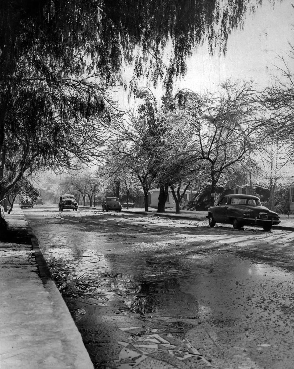 Ice on Gilmore Street in Van Nuys forced vehicles to travel at a crawl.