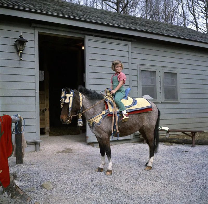 During a weekend at Camp David, Caroline and Macaroni test out a new saddle given to the family by King Hassan II of Morocco.