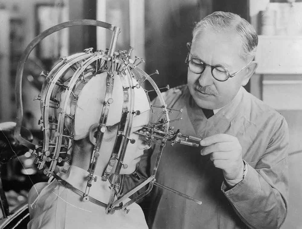 Factor takes measurements of a woman’s features with a beauty micrometer.