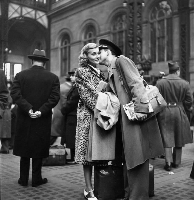 Couple in Penn Station saying goodbye before he ships off to war during WWII, New York, 1943.