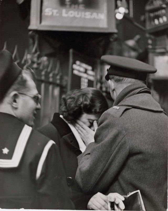 Soldier consoling his weeping girlfriend while saying goodbye in Pennsylvania Station before returning to duty after a brief furlough, New York, 1943.