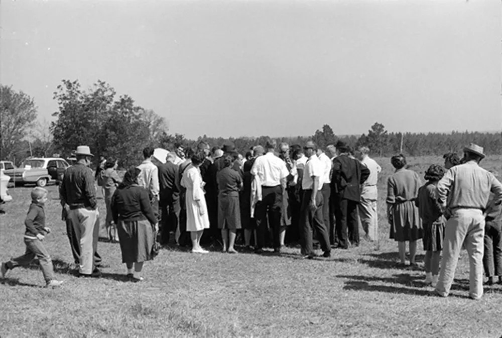 Crowds gather a distance from the Tatum Salt Dome nuclear test site on October 22, 1964.