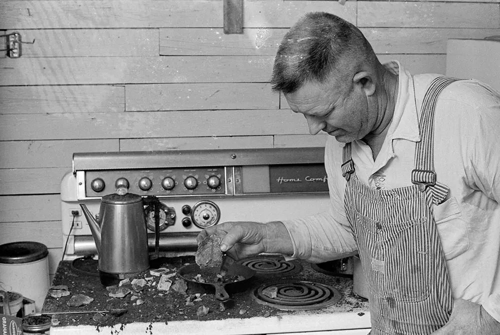 Horace Burge surveys the damage to his kitchen.