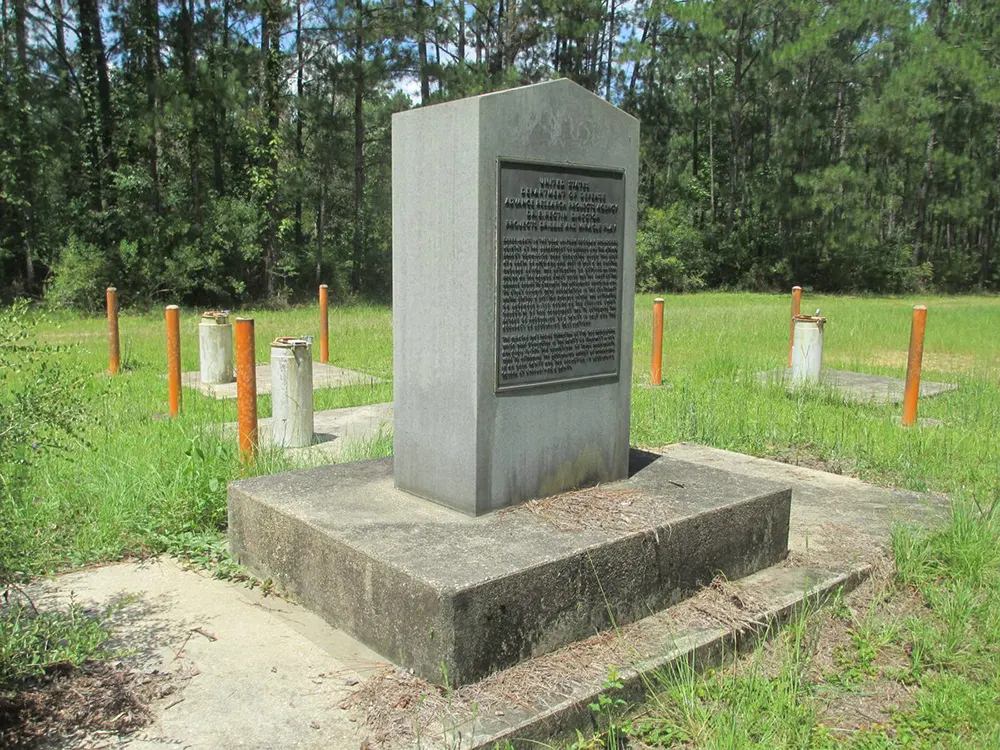 A granite monument surrounded by test wells marks the site of the nuclear bomb tests in southern Mississippi.