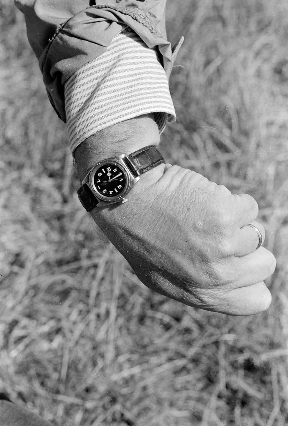 An observer checks his watch at the scheduled time of the blast.