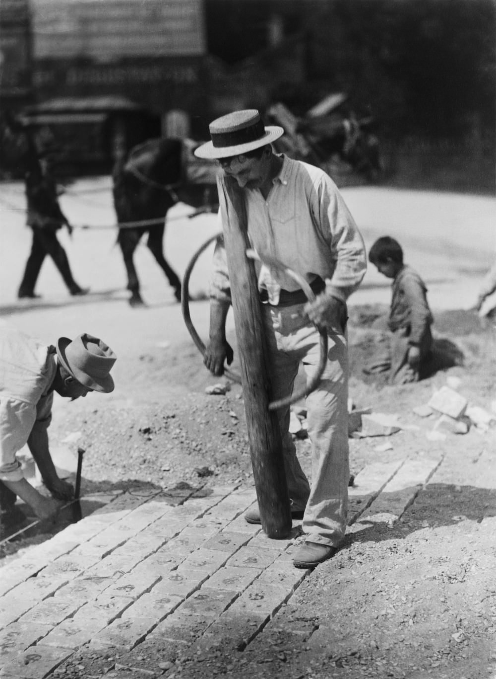 Street paver, 1899.