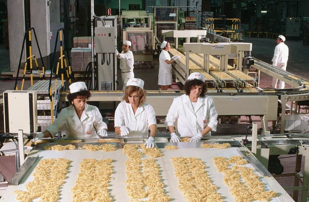 Women sort pasta in the Buitoni pasta factory in Sansepolchro, Italy.