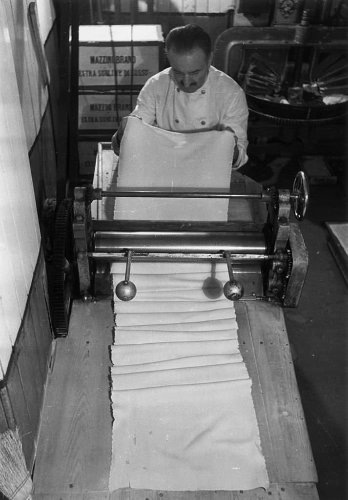 A chef making tagliatelle at King Bomba's, one of the largest Italian shops in Soho, London, 1939