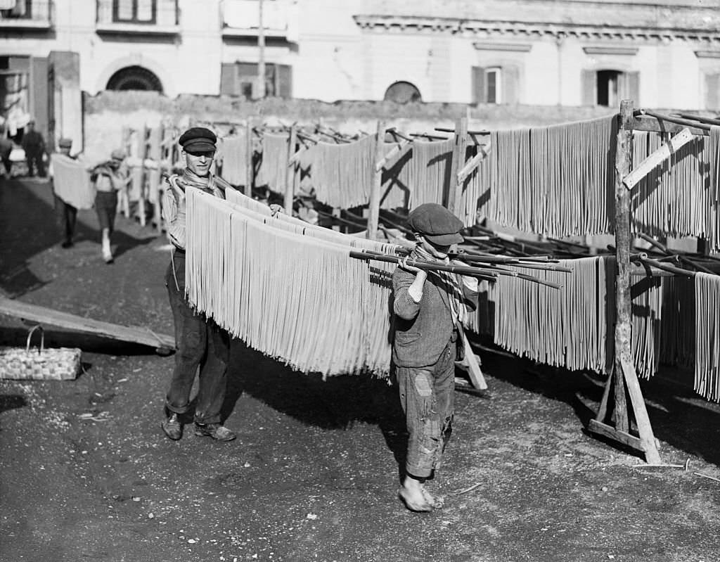 Young Men and Boys Drying Macaroni