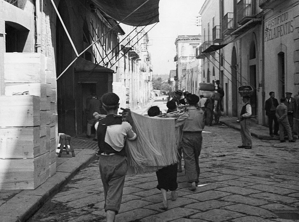 Spaghetti production Carrying spaghetti through the small town of Torre Annunziata, the center of the local spaghetti production, 1932