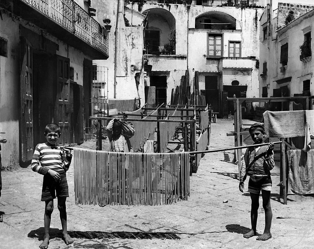 Italy Campania Salerno. Food preparation of Macaroni, drying the Macaroni in the courtyard, 1928