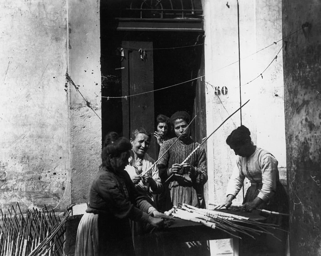 A group of women making macaroni by hand, Italy, 1925