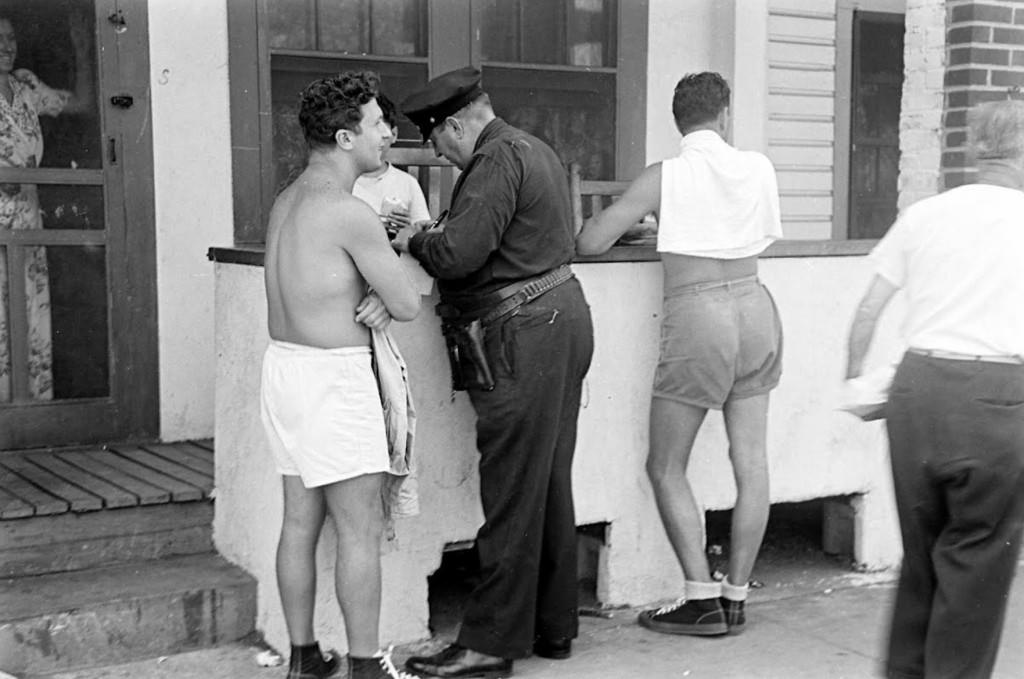 People being ticketed for 'Indecent Exposure' at Rockaway Beach of New York City, 1946