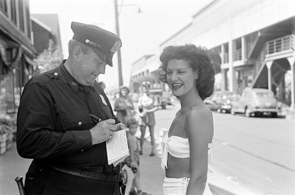 People being ticketed for 'Indecent Exposure' at Rockaway Beach of New York City, 1946